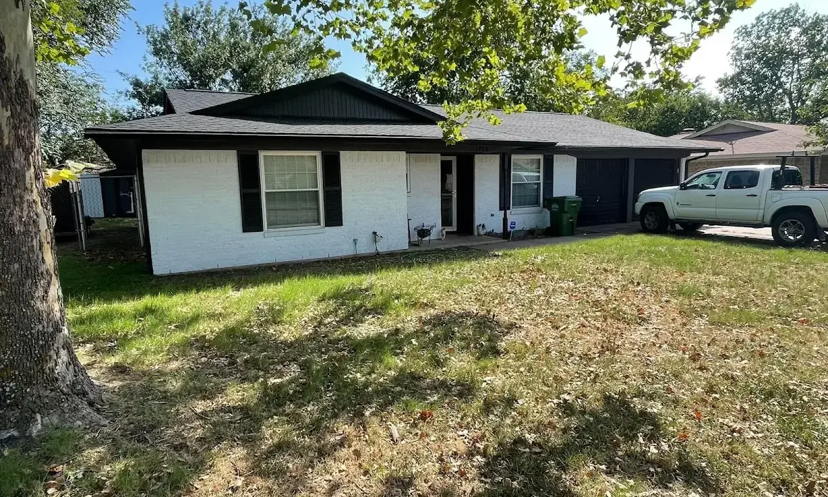Professional roofing crew working on a residential roof in Applewood